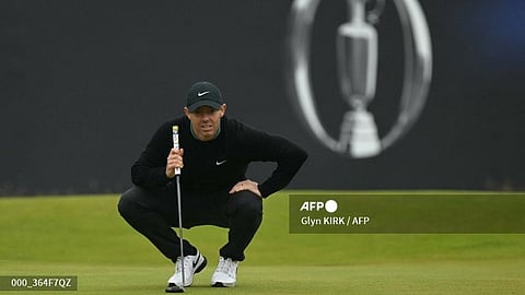 GOLF-GBR-OPEN
Northern Ireland's Rory McIlroy lines up a putt on the 18th green on the opening day of the 152nd British Open Golf Championship at Royal Troon on the south west coast of Scotland on July 18, 2024.
Glyn KIRK / AFP