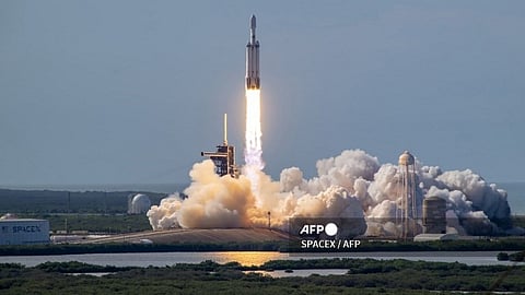 This handout image released by SpaceX shows a SpaceX Falcon Heavy rocket carrying the National Oceanic and Atmospheric Administration's (NOAA) weather satellite Geostationary Operational Environmental Satellite U (GOES-U) launching from Cape Canaveral, Florida, June 25, 2024. SPACEX / AFP