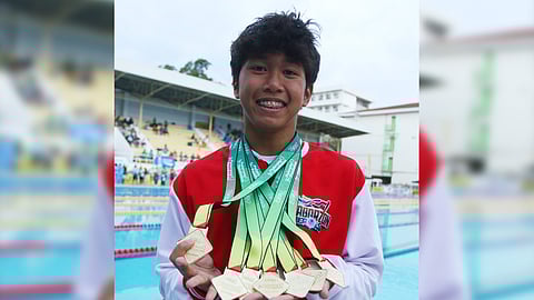 Swimmer T.J. Amaro of San Beda-Rizal proudly shows off his Palarong Pambansa haul of seven gold medals.