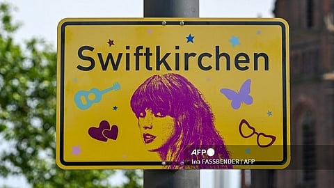 A newly designed city sign with the lettering 'Swiftkirchen' is seen in Gelsenkirchen, western Germany on July 17, 2024, prior to the first of three concerts that US musician and pop icon Taylor Swift will perform at the Veltins Arena as part of her 'Eras Tour'. Swift's concerts with take place on July 17, 18 and 19, 2024.
