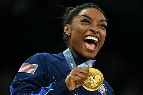 SIMONE Biles celebrates after powering the United States to the gold medal of the team event of the Paris Olympics.