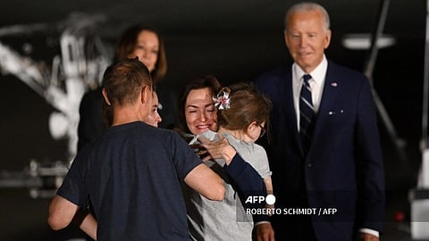 Journalist Alsu Kurmasheva embraces her family.