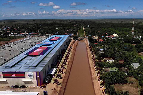 Cambodia-canal-environment An aerial view shows heavy construction equipment lining the edge of the canal after a groundbreaking ceremony for the Funan Techo Canal in Kandal province. Manet launched the controversial $1.7-billion canal project that aims to provide a new link from the Mekong River to the sea. Manet called the 180-kilometer project ‘historic’ and vowed to ‘finish it at all costs.’