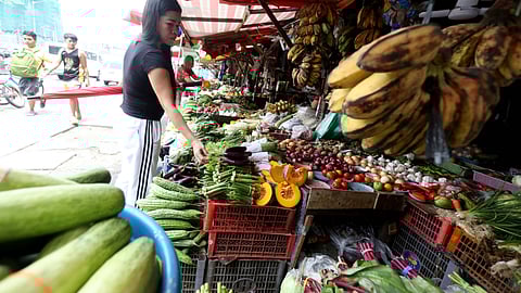 (FILES) Customers are seen buying vegetables at Tandangsora Market in Quezon City, on Sunday, 14 July 2024, according to a new survey conducted by Pulse Asia Research in June, a month ahead of the president's third State of the Nation Address.