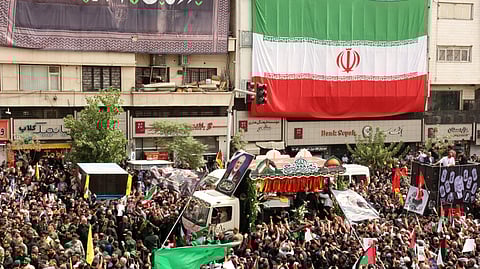 The caskets of Hamas political chief Ismail Haniyeh and his bodyguard were borne on a flower-decorated truck in Tehran on August 1, 2024.