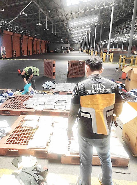 Customs Intelligence and Investigation Service personnel inspect a shipment from Thailand that was intercepted by the Bureau of Customs. The shipment, containing P38.8 million worth of dried marijuana, was thwarted from entering the country last week.