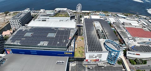 ROOFTOP of the MOA Square building (left) with the 3,672 solar panels installed.