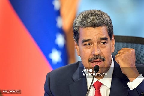 Venezuelan President Nicolas Maduro gestures during a press conference about the presidential election at the Miraflores presidential palace in Caracas on August 2, 2024. The ruling TSJ summoned candidates of last presidential election, accused by the opposition of being fraudulent, after accepting an appeal by the proclaimed winner Nicolas Maduro for the highest court to certify the process.