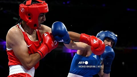 Algeria's Imane Khelif (in red) punches Italy's Angela Carini in the women's 66kg preliminaries round of 16 boxing match during the Paris 2024 Olympic Games at the North Paris Arena, in Villepinte on 1 August 2024.