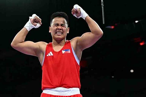 NESTHY Petecio celebrates her emphatic 5-0 victory over Xu Zinchu of China in their featherweight quarterfinal round bout Sunday in the Paris Olympics. The win assured Petecio of a bronze as she shoots for a silver in the semifinal on Wednesday.