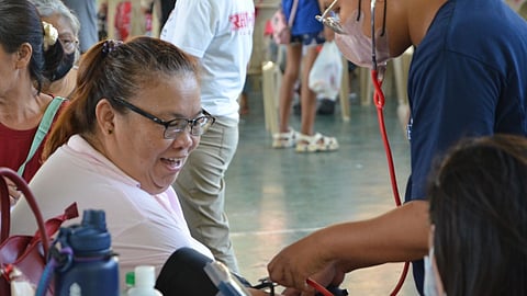 A beneficiary undergoing a blood pressure test