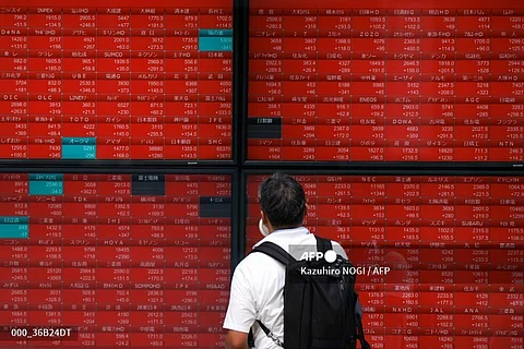 LOOK: A man looks at an electronic quotation board displaying stock prices of Nikkei 225 on the Tokyo Stock Exchange in Tokyo on 6 August, 2024. Tokyo stocks bounced back in early trade on August 6 following a historic selloff on worries over the US economy and a stronger yen.