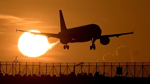 A commercial plane prepares to land at Ngurah Rai international airport in Denpasar, on Indonesia's Bali island