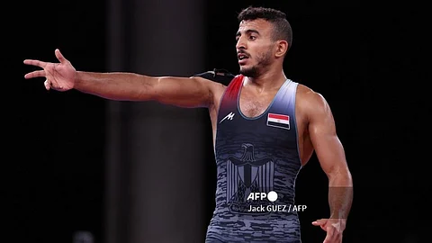 (FILES) Egypt's Mohamed Ibrahim Elsayed reacts after being defeated by Ukraine's Parviz Nasibov in their men's greco-roman 67kg wrestling semi-final match during the Tokyo 2020 Olympic Games at the Makuhari Messe in Tokyo on August 3, 2021. French police early August 8, 2024, arrested an Egyptian wrestler taking part in the Olympics over allegedly groping a woman in a bar, prosecutors said. Authorities detained Mohamed Elsayed, 26, in front of a cafe in the French capital's 13th district at around 5 am after he was accused of "placing a hand on the buttocks of a woman patron", the Paris prosecutor's office said.