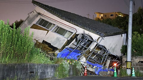 A collapsed house is seen following an earthquake in Osaki town on 8 August. Experts have warned of a megaquake hitting Japan as PM Fumio Kishida cancels visit to central Asia for a summit in Kazakhstan.