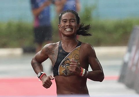 John Alcala braces for a rough outing in the IRONMAN 70.3 in Davao City.
