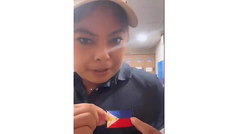 Golfer Dottie Ardina shows in a screengrab how she remedied her uniform problems in the Paris Olympics.