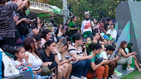 YOUNG residents of Manila eagerly await the Earth Hour countdown at Kartilya ng Katipunan in Ermita district. The event aims to remind everyone’s accountability in reducing ecological footprint.