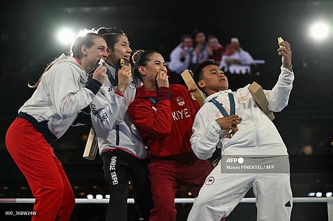 LIN Yu-ting shares the stage with Julia Szeremeta of Poland, Esra Yildiz Kahraman of Turkey, and Nesthy Petecio of the Philippines after winning the gold medal in the women’s 57-kilogram boxing event of the Paris Olympics.