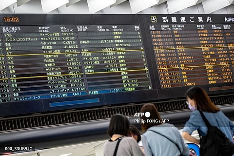 A general view shows flight information at the arrival hall of Narita International Airport in Narita, Chiba Prefecture, outside Tokyo on September 7, 2023.