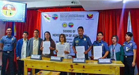 A Memorandum of Agreement (MoA) was signed between the Bureau of Jail Management and Penology (BJMP) Cordillera and the Department of Education (DepEd) Cordillera to enhance the "Tagapangalaga ko, Guro ko" initiative through DepEd's Alternative Learning System (ALS) program. The agreement was signed by BJMP Cordillera Regional Director Kenneth Bid-ing and DepEd Cordillera's Estela Cariño at the Baguio City Jail Male Dormitory on August 13, 2024.