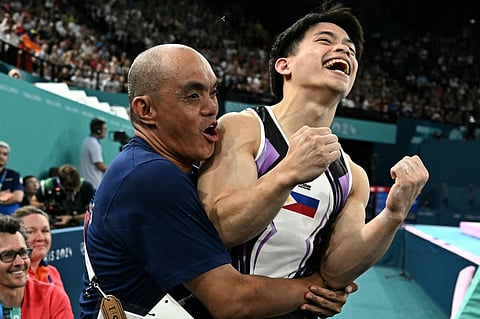 ALDRIN Castañeda celebrates Carlos Yulo’s victory during the Paris Olympics.