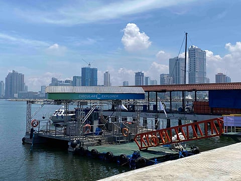 Holcim Philippines' Circular Economy vessel docked in Manila Bay.