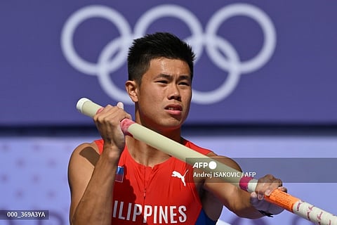 LOOK: Philippines' Ernest John Obiena prepares to compete in the men's pole vault qualification of the athletics event at the Paris 2024 Olympic Games at Stade de France in Saint-Denis, north of Paris, on 3 August 2024. | đź“·Andrej ISAKOVIC / AFP