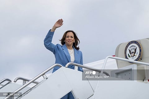 US Vice President and Democratic presidential candidate Kamala Harris waves as boards Air Force Two at Raleigh-Durham International Airport in Morrisville, North Carolina, August 16, 2024. Harris unveiled an economic blueprint heavy on popular measures to cut costs for Americans, while attacking powerful companies for price gouging, as she fleshes out her election platform ahead of the Democratic National Convention.