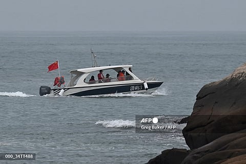 LOOK: A Chinese sightseeing boat sails past a tourist spot called "68 Nautical Miles" on Pingtan island, the closest point in China to Taiwan’s main island, in southeast China’s Fujian province on May 24, 2024. China warned on May 24 that Taiwan's leadership was pushing the self-ruled island into "a perilous situation of war and danger" and that it would go "further" if provoked, as Beijing conducted military drills around the territory.| 📷 Greg Baker / AFP