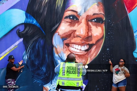 A Chicago police officer takes a picture of people posing before a mural of Democratic presidential nominee US Vice President Kamala Harris outside the United Center ahead of the Democratic National Convention (DNC) in Chicago, Illinois on August 17, 2024. The mural, created by Ian Robertson and Salt and Pique Brown, was commissioned by Emily’s List in 2020.
Vice President Kamala Harris will formally accept the party’s nomination for president at the DNC which runs from August 19-22 in Chicago.