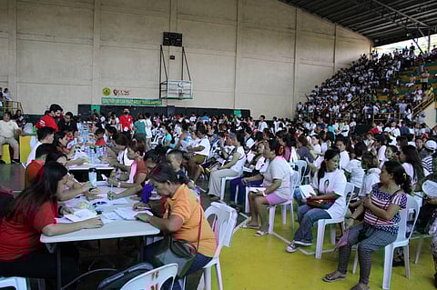 YOUTH Development Workers from BARMM (left) and Central Visayas receive their ‘Tara Basa! Tutoring Program’ cash incentives from DSWD staffs.