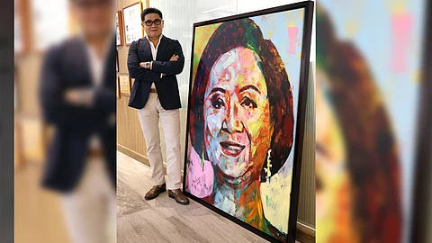 ANTON Huang with a portrait of his mother Nedy Tantoco.