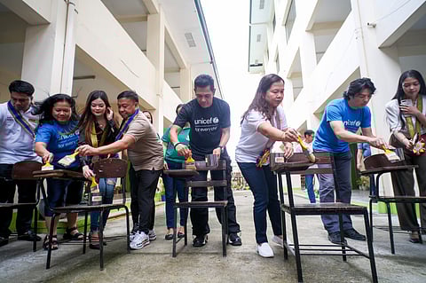 GARY Valenciano (4th from right) and other volunteers paint chairs of Lydia D. Villangca Trade School in San Rafael, Bulacan last 13 August.