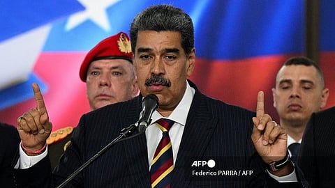 (FILES) Venezuela's President Nicolas Maduro (C) addresses the media after appearing before the Supreme Court of Justice (TSJ) in Caracas on 9 August 2024. After his disputed re-election in July, Venezuelan President Nicolas Maduro launched a major offensive against social networks, which the government has promised to regulate by law in the next few days.