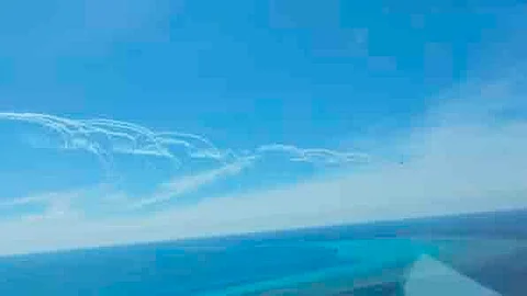 Screengrab from a Philippine Coast Guard video taken on 19 August shows a People’s Liberation Army Air Force fighter jet (encircled) deploying flares near a Bureau of Fisheries and Aquatic Resources plane conducting a maritime domain awareness flight near the Chinese-controlled Scarborough Shoal.