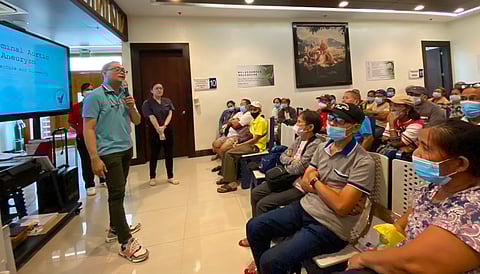 MICHAEL Anthony dela Cruz (left), consultant-vascular cardiologist at Cardinal Santos Medical Center and head of the Council on Aortic Diseases-Philippine Society of Vascular Medicine, orients patients at the Tzu Chi Eye Center on abdominal aortic aneurysm on 17 August 2024.