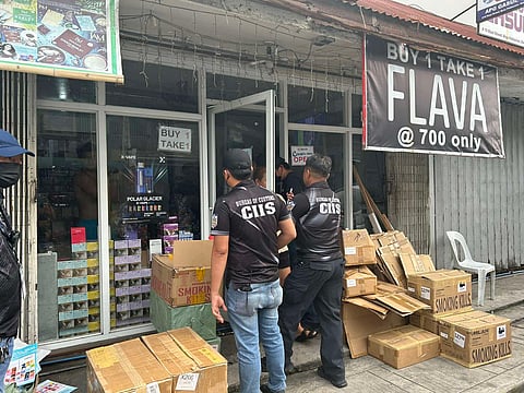 Operatives from the Bureau of Customs inspect a warehouse in Quiapo, Manila which yielded smuggled vapes.