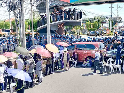 MEMBERS of the Kingdom of Jesus Christ barricade CP Garcia Highway in Davao City in an effort to stop the police from arresting their leader, Pastor Apollo Quiboloy, believed holed up in their sprawling headquarters.