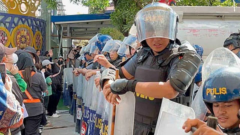 (FILE PHOTO) MEMBERS of the Kingdom of Jesus Christ barricade CP Garcia Highway in Davao City in an effort to stop the police from arresting their leader, Pastor Apollo Quiboloy, believed holed up in their sprawling headquarters.
