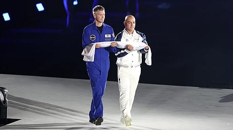 John McFall, British Surgeon and former Paralympian, carries the Paralympic flag onto the stage prior to the declaration of the games during the opening ceremony of the Paris 2024 Summer Paralympic Games at Place de la Concorde on 28 Aug. 2024 in Paris, France.