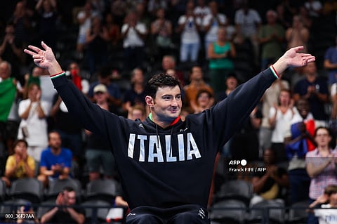 FRANCESCO Bocciardo celebrates at the podium after defending his men’s 200m S5 freestyle swimming title in the Paris Paralympics at The La Defense Arena.