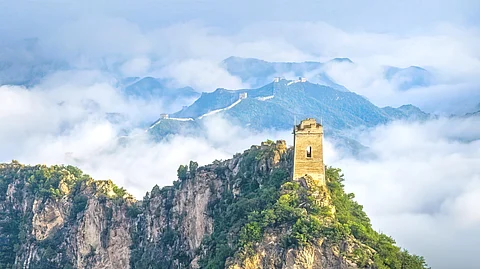 The Great Wall, spanning 21,196.18 kilometers, is the world’s largest man-made structure. It stretches from the eastern seaside to the western desert of northern China, winding through mountains and plateaus.