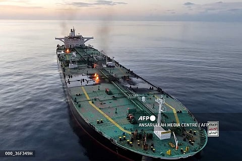 This picture released on August 29, 2024 by Yemen's Huthi Ansarullah Media Centre, shows fire and smoke aboard what they say is the Greek-owned oil tanker Sounion which they reportedly hit by three projectiles on August 21, 2023. Yemeni rebels announced on August 29 that they had boarded the oil tanker 'Sounion' earlier this week, which they had previously attacked in the Red Sea, and rigged it with explosives and detonated them, causing multiple fires on board.
