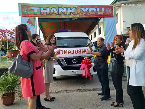 PADRE Burgos Mayor Hermenegildo Culpa (3rd from right) and Embassy of Japan in the Philippines Second Secretary Nishimura Tokiko (3rd from left) cut the ceremonial ribbon for the new ambulance donation as local health staff look on at the municipal hall of Padre Burgos, Southern Leyte on 28 August.