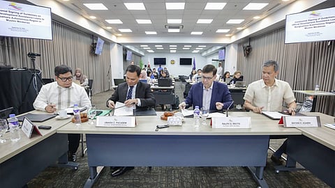 Department of Finance Secretary Ralph Recto and Bangsamoro Government Minister of Finance, Budget and Management Ubaida Pacasem signs the document for the guidelines on official development assistance to the Bangsamoro Autonomous Region in Muslim Mindanao on Tuesday.