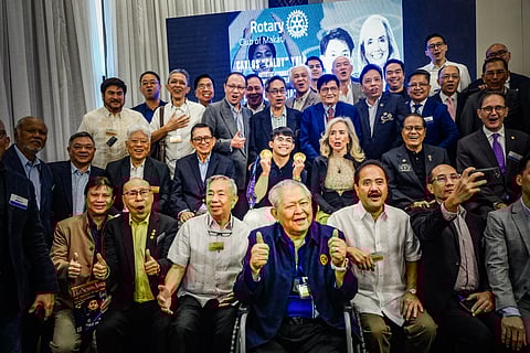CARLOS Yulo (middle) displays his gold medals with members of the Rotary Club of Makati led by Keith Harrison during a recognition ceremony on Tuesday at the Manila Peninsula.
