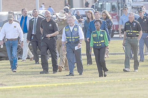 LAW enforcement officials arrive to give a press conference outside of Apalachee High School in Winder, Georgia after a shooting took place.