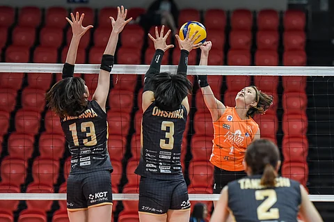 ASAKA Tamaru of Farm Fresh struggles to penetrate the Kurashiki Ablaze defense during their PVL Invitational Conference game last night. The Ablaze prevailed, 25-13, 25-16, 25-16.