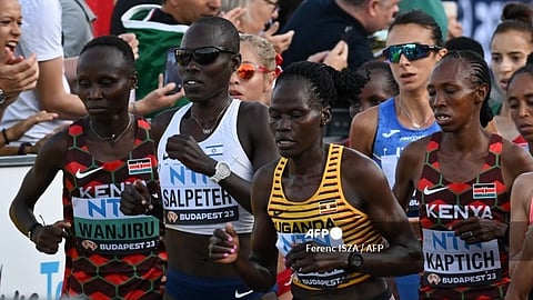 (FILES) (From L to R) Kenya's Rosemary Wanjiru, Israel's Lonah Chemtai Salpeter, Uganda's Rebecca Cheptegei and Kenya's Selly Chepyego Kaptich compete in the women's marathon final during the World Athletics Championships in Budapest on 26 August 2023. Ugandan Olympic athlete Rebecca Cheptegei has died after being set on fire by her boyfriend in Kenya, Uganda's Olympic Committee chief said on 5 September 2024.